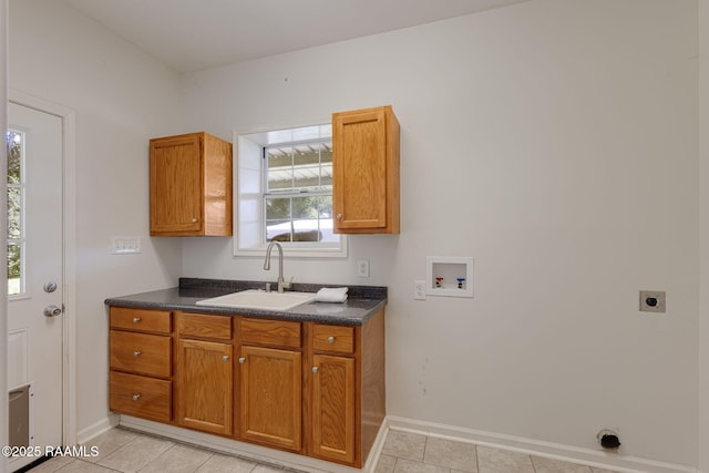 7804 Picard Rd, Maurice, LA 70555 - laundry area with hookup for a washing machine, electric dryer hookup, cabinet space, and light tile patterned floors