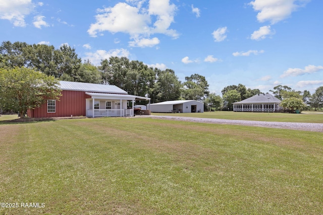 7804 Picard Rd, Maurice, LA 70555 - view of grassy yard with gravel driveway and a porch