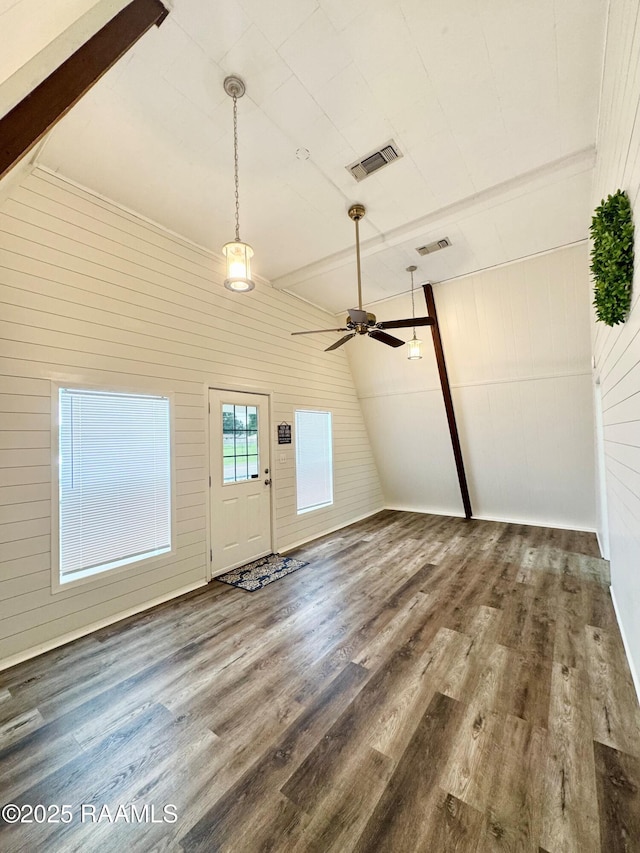 607 Ernest St, New Iberia, LA 70563 - entrance foyer featuring wood finished floors, wooden walls, and ceiling fan