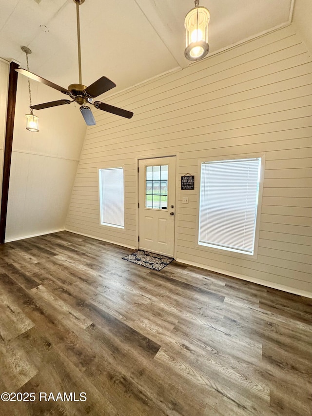 607 Ernest St, New Iberia, LA 70563 - entrance foyer featuring lofted ceiling, wood finished floors, wood walls, and a ceiling fan