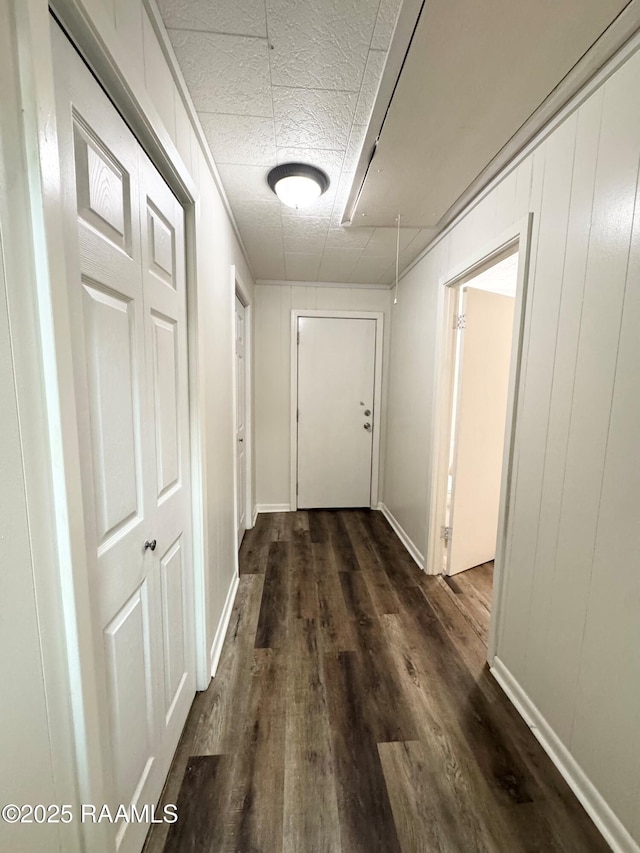 607 Ernest St, New Iberia, LA 70563 - corridor featuring dark wood finished floors and baseboards