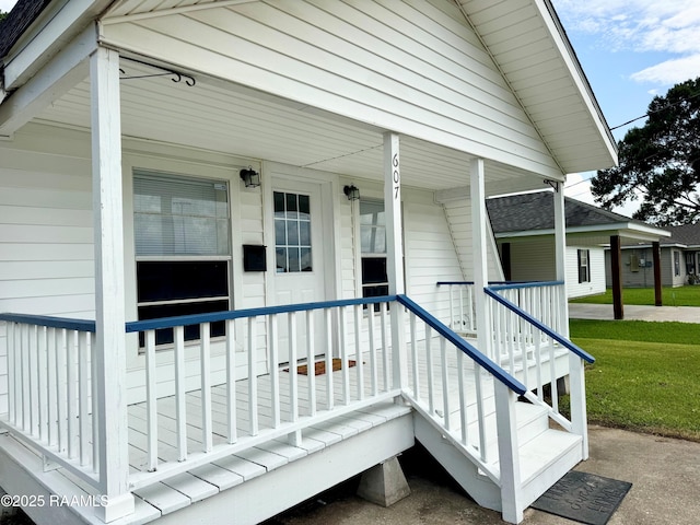 607 Ernest St, New Iberia, LA 70563 - doorway to property with a porch