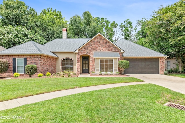 117 Montero Cir, Lafayette, LA 70503 - view of front of property with concrete driveway, a chimney, a shingled roof, a garage, and a front yard