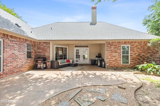 117 Montero Cir, Lafayette, LA 70503 - rear view of property with french doors, a shingled roof, brick siding, and a patio