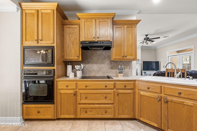 117 Montero Cir, Lafayette, LA 70503 - kitchen with black appliances, extractor fan, ornamental molding, tasteful backsplash, and light countertops