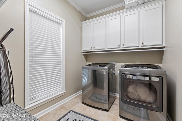 117 Montero Cir, Lafayette, LA 70503 - laundry room with cabinet space, washing machine and dryer, crown molding, and light tile patterned flooring