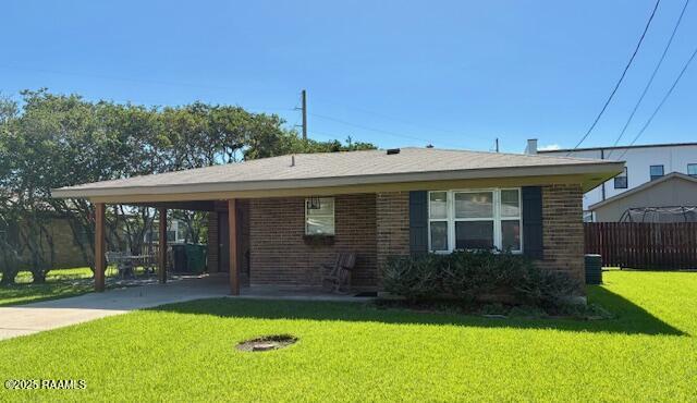 105 Sugar Dr, Broussard, LA 70518 - view of front of house featuring brick siding, a carport, and driveway