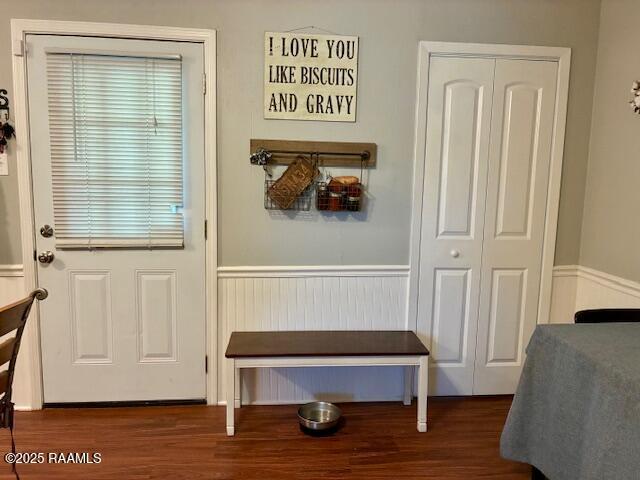 105 Sugar Dr, Broussard, LA 70518 - doorway with wainscoting and wood finished floors