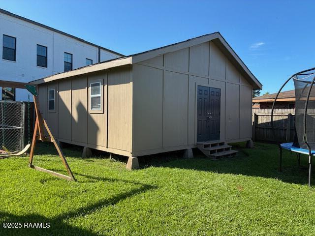 105 Sugar Dr, Broussard, LA 70518 - rear view of house with a trampoline and entry steps