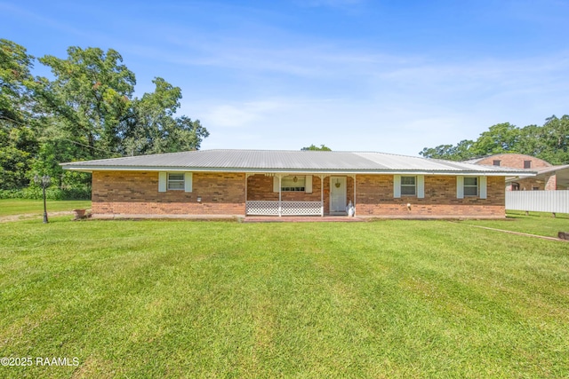 1212 S Main St, Breaux Bridge, LA 70517 - single story home with a front lawn, brick siding, and a metal roof