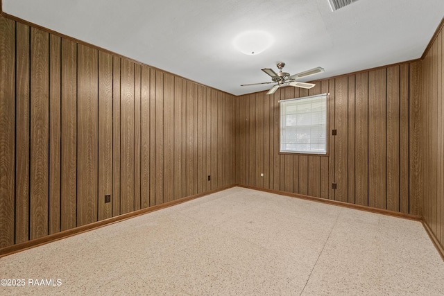 1212 S Main St, Breaux Bridge, LA 70517 - empty room with ceiling fan and wooden walls