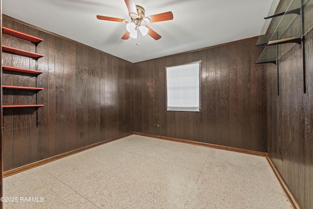 1212 S Main St, Breaux Bridge, LA 70517 - empty room featuring wooden walls and a ceiling fan