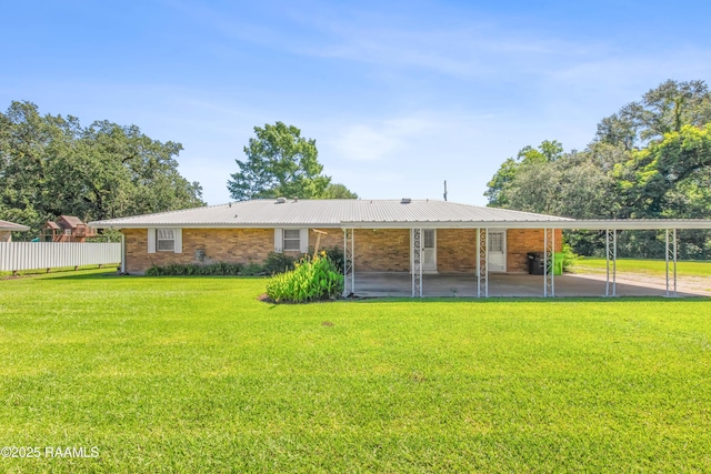 1212 S Main St, Breaux Bridge, LA 70517 - back of house with a metal roof and brick siding