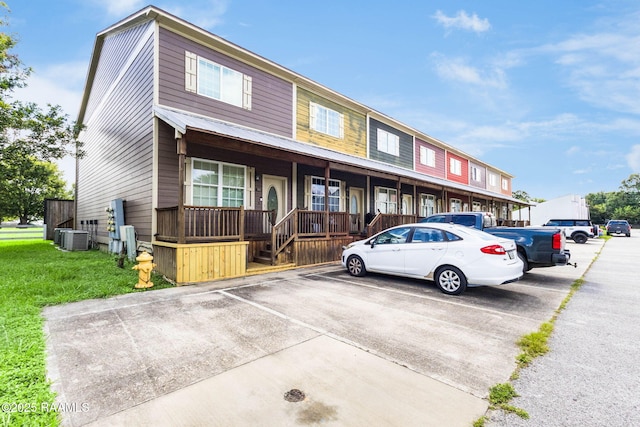 103 Saint Germaine Cir, Lafayette, LA 70506 - townhome / multi-family property featuring uncovered parking and a porch
