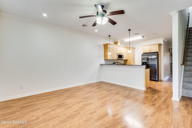 103 Saint Germaine Cir, Lafayette, LA 70506 - kitchen featuring black refrigerator with ice dispenser, stainless steel microwave, ceiling fan, a peninsula, and dark countertops