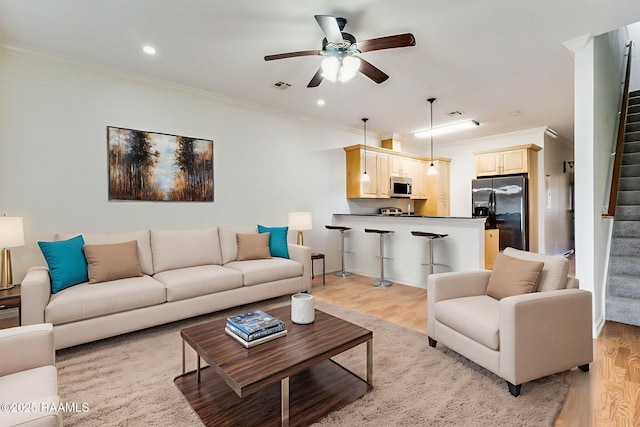 103 Saint Germaine Cir, Lafayette, LA 70506 - living room with stairway, light wood-style floors, a ceiling fan, crown molding, and recessed lighting