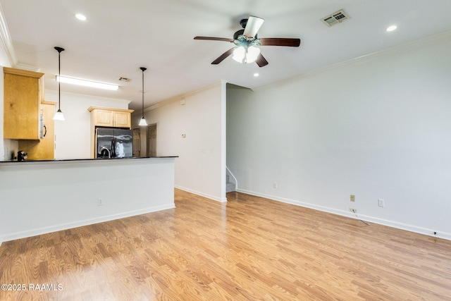 103 Saint Germaine Cir, Lafayette, LA 70506 - kitchen with black fridge with ice dispenser, dark countertops, ornamental molding, light wood-style floors, and ceiling fan