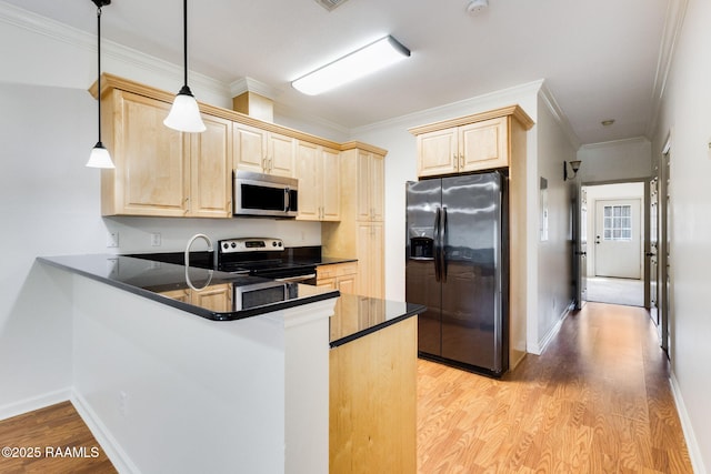 103 Saint Germaine Cir, Lafayette, LA 70506 - kitchen featuring stainless steel appliances, light brown cabinets, dark countertops, light wood finished floors, and a peninsula