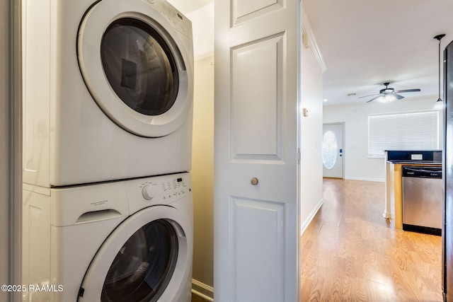 103 Saint Germaine Cir, Lafayette, LA 70506 - laundry room featuring stacked washer / dryer, light wood finished floors, and ceiling fan