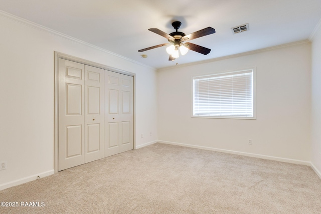 103 Saint Germaine Cir, Lafayette, LA 70506 - unfurnished bedroom featuring crown molding, carpet flooring, a closet, and a ceiling fan