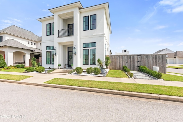 100 Catamaran Dr, Youngsville, LA 70592 - view of front of property with stucco siding and a balcony