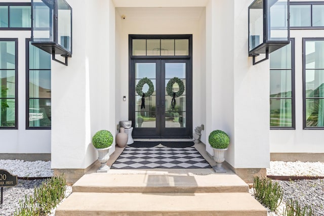 100 Catamaran Dr, Youngsville, LA 70592 - doorway to property with french doors and stucco siding
