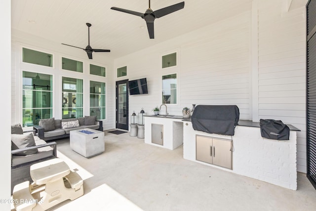 100 Catamaran Dr, Youngsville, LA 70592 - view of patio / terrace with area for grilling, an outdoor living space with a fire pit, and a ceiling fan