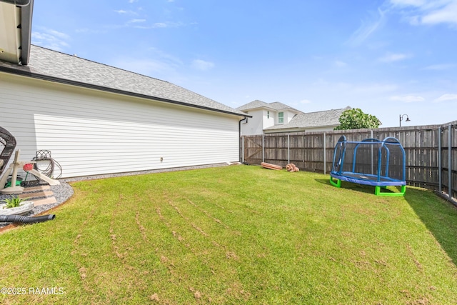 100 Catamaran Dr, Youngsville, LA 70592 - fenced backyard featuring a trampoline