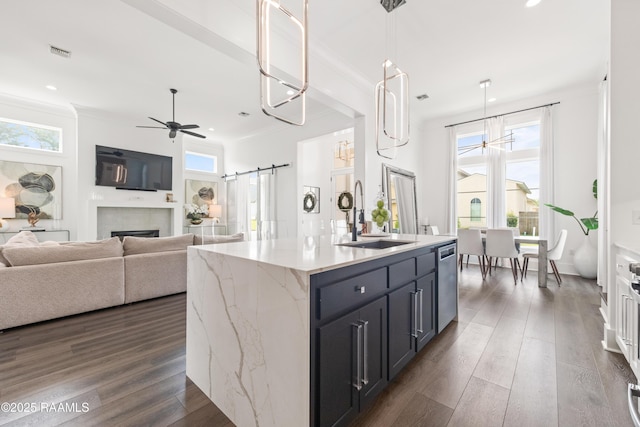 100 Catamaran Dr, Youngsville, LA 70592 - kitchen featuring dishwasher, a barn door, a ceiling fan, dark wood-type flooring, and recessed lighting