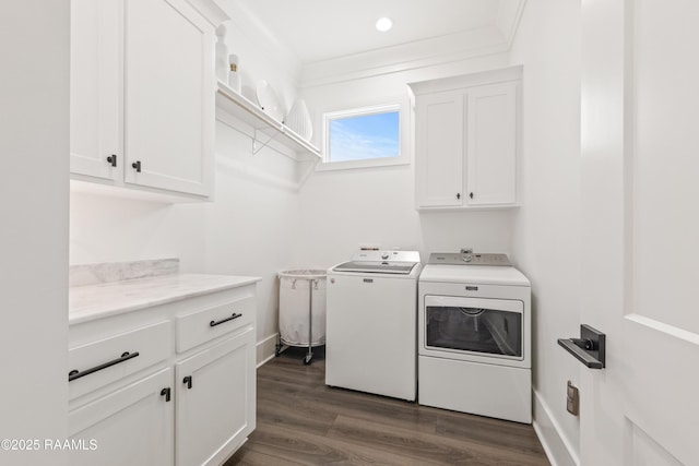 100 Catamaran Dr, Youngsville, LA 70592 - washroom with cabinet space, washer and dryer, and dark wood-type flooring