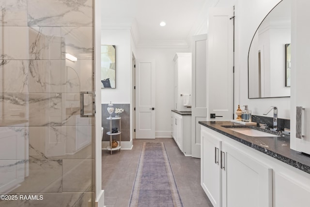 100 Catamaran Dr, Youngsville, LA 70592 - bathroom featuring vanity, a marble finish shower, crown molding, and recessed lighting