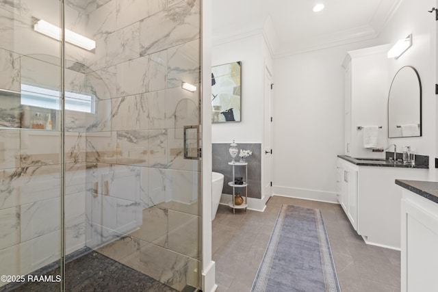 100 Catamaran Dr, Youngsville, LA 70592 - full bath featuring vanity, ornamental molding, a marble finish shower, a freestanding tub, and tile walls