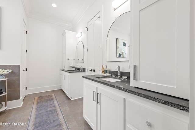 100 Catamaran Dr, Youngsville, LA 70592 - bathroom featuring two vanities, ornamental molding, recessed lighting, and tile patterned floors