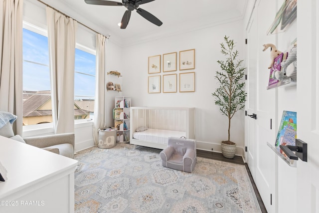 100 Catamaran Dr, Youngsville, LA 70592 - sitting room with a ceiling fan, wood finished floors, and crown molding