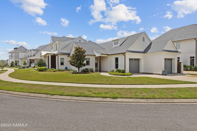 106 Sonoma Way, Lafayette, LA 70508 - view of front facade featuring an attached garage, concrete driveway, a front lawn, and board and batten siding