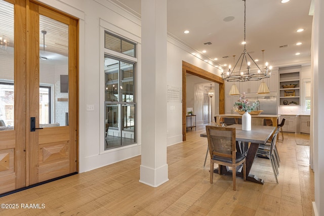 106 Sonoma Way, Lafayette, LA 70508 - dining room featuring crown molding, a chandelier, recessed lighting, light wood-type flooring, and plenty of natural light