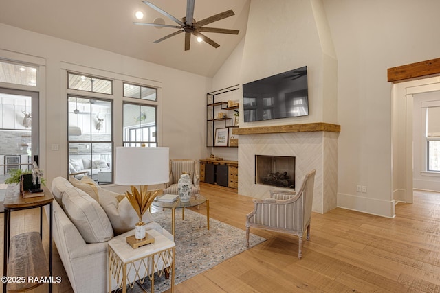 106 Sonoma Way, Lafayette, LA 70508 - living room featuring a ceiling fan, high vaulted ceiling, wood finished floors, plenty of natural light, and a premium fireplace