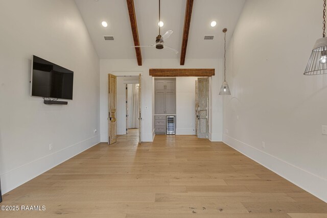 106 Sonoma Way, Lafayette, LA 70508 - unfurnished living room with a ceiling fan, beam ceiling, light wood-style flooring, wine cooler, and high vaulted ceiling