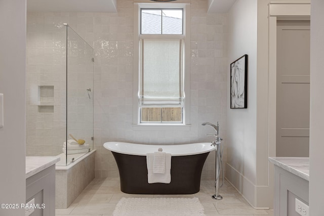 106 Sonoma Way, Lafayette, LA 70508 - full bath featuring a freestanding tub, vanity, tile patterned flooring, a tile shower, and tile walls
