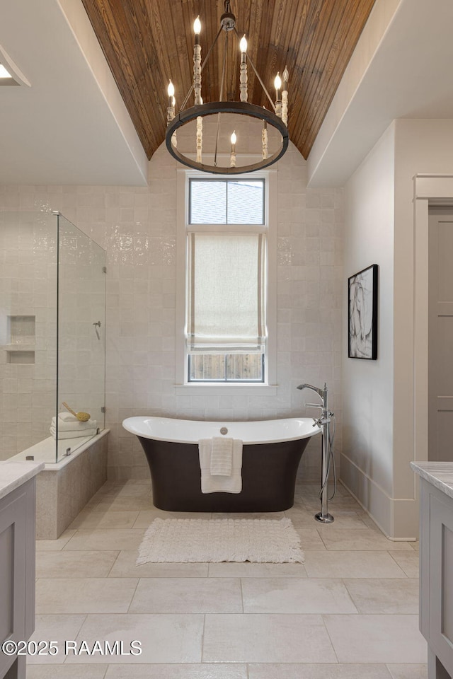 106 Sonoma Way, Lafayette, LA 70508 - bathroom featuring wood ceiling, a soaking tub, tile walls, lofted ceiling, and vanity