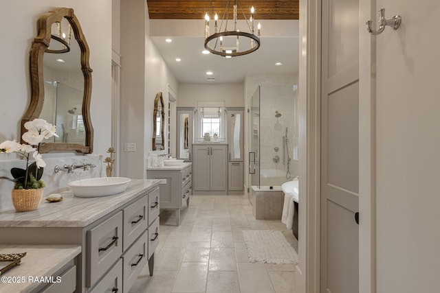 106 Sonoma Way, Lafayette, LA 70508 - full bathroom featuring a shower stall, two vanities, a chandelier, tile patterned floors, and recessed lighting