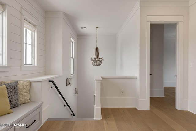 106 Sonoma Way, Lafayette, LA 70508 - corridor featuring an upstairs landing, light wood-type flooring, and a chandelier