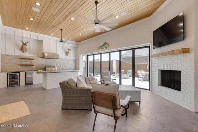 106 Sonoma Way, Lafayette, LA 70508 - living area with wooden ceiling, ceiling fan, recessed lighting, wine cooler, and a fireplace