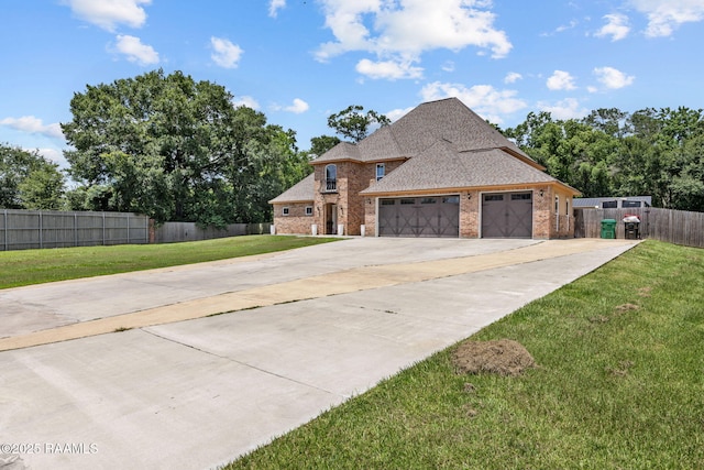 213 E Peck Blvd, Lafayette, LA 70508 - french provincial home featuring brick siding, concrete driveway, a garage, and a shingled roof