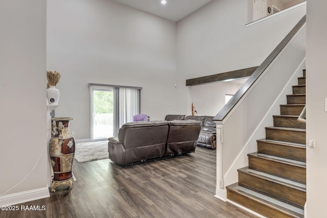 213 E Peck Blvd, Lafayette, LA 70508 - living room with a high ceiling, stairs, and wood finished floors