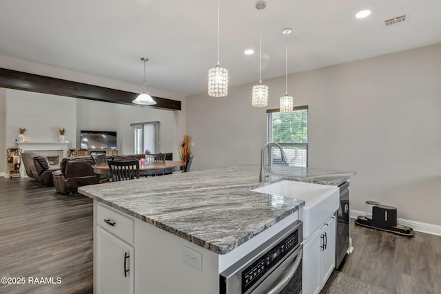 213 E Peck Blvd, Lafayette, LA 70508 - kitchen featuring dark wood finished floors, light stone counters, white cabinets, hanging light fixtures, and recessed lighting