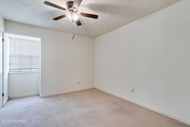 2421 Robley Dr, Lafayette, LA 70503 - spare room featuring carpet, ceiling fan, and a textured ceiling