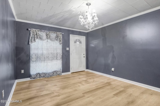 809 Cecile Blvd, Breaux Bridge, LA 70517 - unfurnished room with a chandelier, crown molding, and wood finished floors