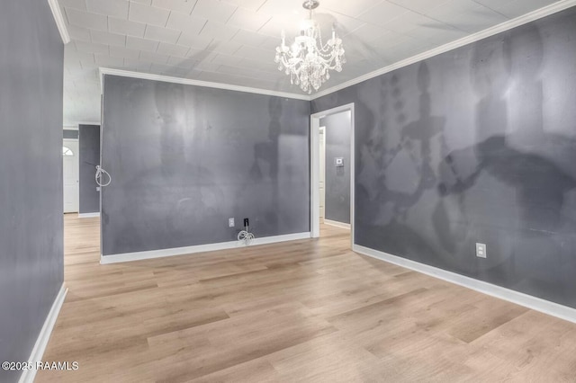 809 Cecile Blvd, Breaux Bridge, LA 70517 - spare room with a chandelier, ornamental molding, and wood finished floors