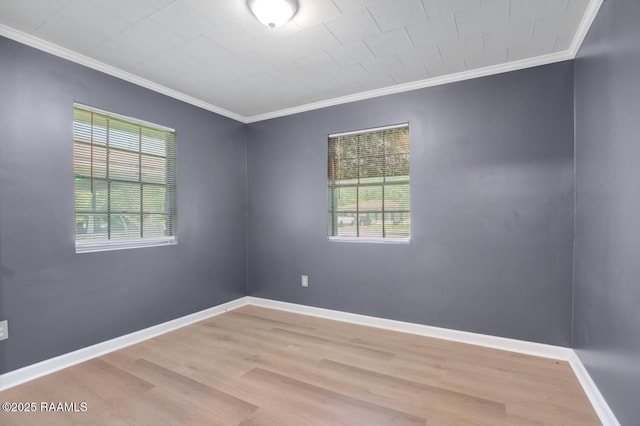 809 Cecile Blvd, Breaux Bridge, LA 70517 - spare room with crown molding, healthy amount of natural light, and wood finished floors